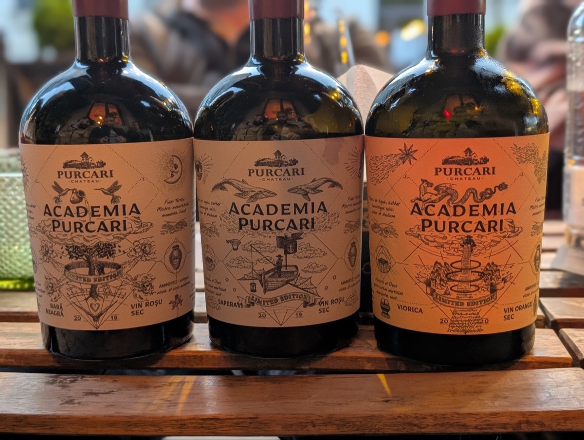 Three Academia Purcari bottles on the table